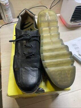 Fly London Men’s Black Leather Slip-On Loafer with Transparent Sole #632